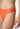 Nahaufnahme von einem Damen-Model, das HU almost orange mikrofaser String trägt