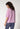 Rückansicht von einem Damen-Model, das HU almost pink baumwolle Shirt kurzarm trägt
