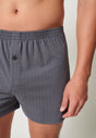 Nahaufnahme von einem Herren-Model, das HU turbulence herringbone baumwolle Boxershorts trägt
