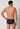 Rückansicht von einem Herren-Model, das HU outer space minimal baumwolle Slip mit Eingriff trägt