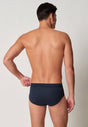Rückansicht von einem Herren-Model, das HU outer space minimal baumwolle Slip mit Eingriff trägt