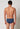 Rückansicht von einem Herren-Model, das HU ensign blue minimal modal/viskose/tencel Slip trägt