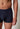 Nahaufnahme von einem Herren-Model, das HU outer space modal/viskose/tencel Pants trägt