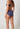 Rückansicht von einem Damen-Model, das HU blue indigo baumwolle Midi Slip Doppelpack trägt