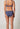 Rückansicht von einem Damen-Model, das HU blue indigo mikrofaser Rio Slip Doppelpack trägt