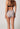 Rückansicht von einem Damen-Model, das HU leo mikrofaser Maxi Slip trägt