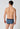 Rückansicht von einem Herren-Model, das HU dark denim rhombus baumwolle Slip mit Eingriff trägt
