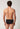 Rückansicht von einem Herren-Model, das HU black baumwolle Slip Doppelpack trägt