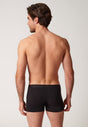 Rückansicht von einem Herren-Model, das HU black baumwolle Pants Doppelpack trägt