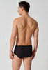 Rückansicht von einem Herren-Model, das HU black baumwolle Slip mit Eingriff Doppelpack trägt
