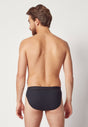 Rückansicht von einem Herren-Model, das HU black baumwolle Slip Doppelpack trägt