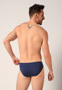 Rückansicht von einem Herren-Model, das HU blue-black selection baumwolle Slip 3er Pack trägt