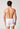 Rückansicht von einem Herren-Model, das HU white baumwolle Pants mit Eingriff trägt