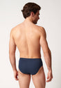 Rückansicht von einem Herren-Model, das HU navy baumwolle Slip mit Eingriff trägt