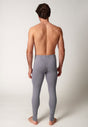 Rückansicht von einem Herren-Model, das HU ash baumwolle Pants lang mit Eingriff trägt