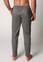 Rückansicht von einem Herren-Model, das HU grey melange baumwolle Hose lang trägt