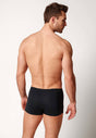 Rückansicht von einem Herren-Model, das HU black modal/viskose/tencel Pants trägt