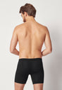 Rückansicht von einem Herren-Model, das HU black modal/viskose/tencel Pants langes Bein trägt