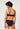 Rückansicht von einem Damen-Model, das HU black mikrofaser Bandeau BH trägt