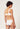 Rückansicht von einem Damen-Model, das HU white mikrofaser Minimizer BH trägt