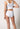 Rückansicht von einem Damen-Model, das HU white baumwolle Midi Slip Doppelpack trägt
