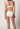 Rückansicht von einem Damen-Model, das HU white baumwolle Midi Slip Doppelpack trägt