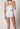 Rückansicht von einem Damen-Model, das HU white baumwolle Maxi Slip 4er Pack trägt