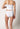 Rückansicht von einem Damen-Model, das HU white baumwolle Rio Slip 4er Pack trägt