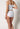 Rückansicht von einem Damen-Model, das HU white baumwolle Maxi Slip trägt