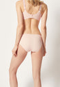 Rückansicht von einem Damen-Model, das HU dusty rose mikrofaser Rio Slip trägt