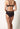 Rückansicht von einem Damen-Model, das HU black mikrofaser Panty trägt