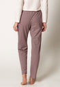 Rückansicht von einem Damen-Model, das HU rose denim stripes baumwolle Hose lang trägt