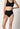 Vorderansicht von einem Damen-Model, das HU black mikrofaser Taillien Slip trägt
