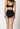 Rückansicht von einem Damen-Model, das HU black mikrofaser Taillien Slip trägt