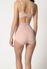 Rückansicht von einem Damen-Model, das HU dusty rose mikrofaser Taillien Pants trägt