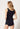 Rückansicht von einem Damen-Model, das HU black modal/viskose/tencel Tanktop trägt