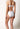 Rückansicht von einem Damen-Model, das HU white mikrofaser Rio Slip trägt